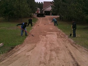 crew preparing base for paving